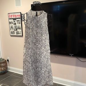 Snake skin print sleeveless cocktail dress with beaded detail on front